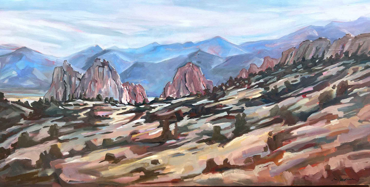 Painting of a desert landscape with rocky formations and mountains.