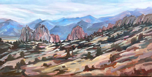 Painting of a desert landscape with rocky formations and mountains.
